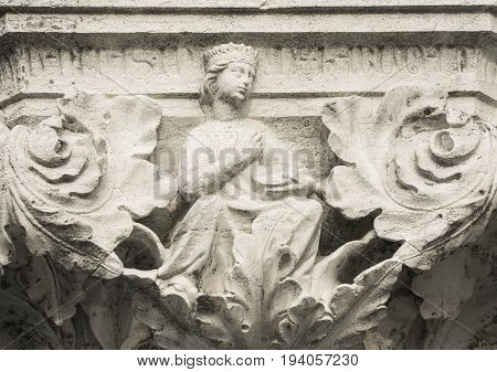 Queen Princess or Damsel with tambourine ancient medieval relief on Venice Doge Palace column