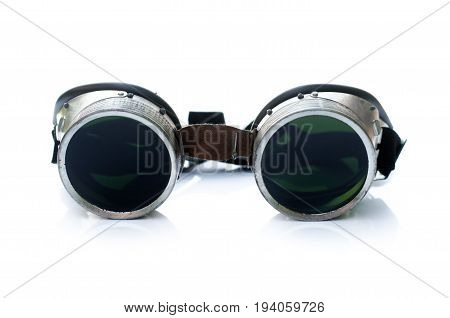 Welding glasses with tint glass isolated on white background.