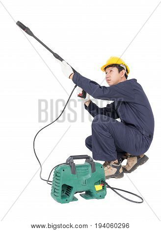 Young Man Sitting And Holding High Pressure Water Gun