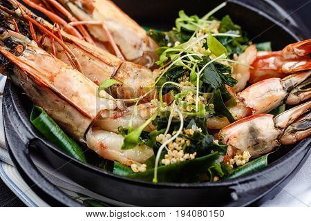 Royal prawns served with herbs and quinoa.
