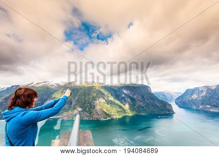 Tourist Taking Photo From Stegastein Viewpoint Norway