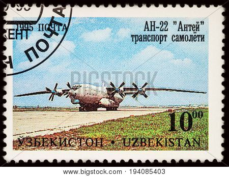 Moscow Russia - July 05 2017: A stamp printed in Uzbekistan shows transport plane Antonov AN-22 (Antaeus) series 