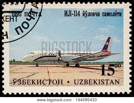 Moscow Russia - July 05 2017: A stamp printed in Uzbekistan shows airliner Ilyushin IL-114 series 
