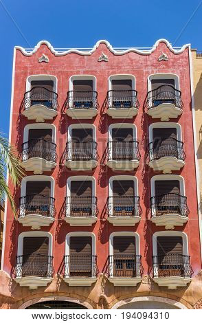 Colorful Red Apartment Building At The Main Square Of Ayora