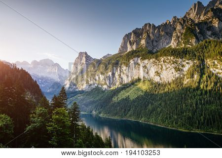 Stunning image of alpine lake Vorderer Gosausee. Picturesque and gorgeous morning scene. Salzkammergut is a located in the Gosau Valley in Upper Austria. Dachstein glacier. Explore the world's beauty.