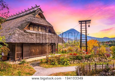 Mt. Fuji, Japan with historic village Iyashi no Sato during autumn