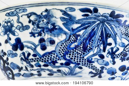 Closeup of antique 18th century Chinese porcelain four claw dragon.