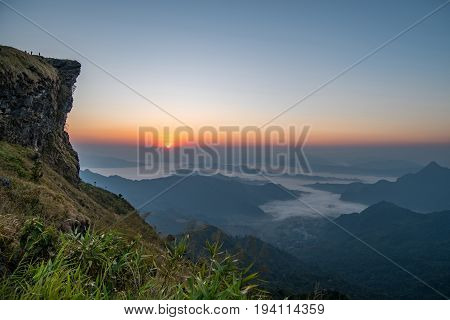High cliff mountain landscape and mist on the hill of Phu Chi Fa (Phu Chee Fa) during sunrise natural landmark and famous attraction of Chiang Rai Thailand