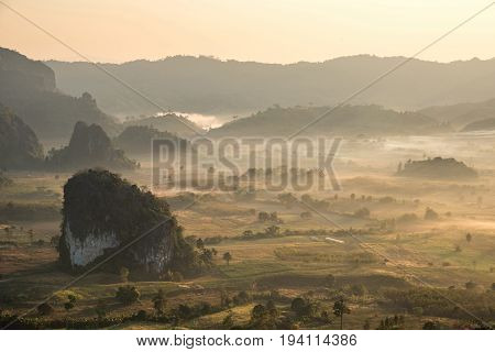 scenic mountain landscape and fog on the hill in Phu Lung ka forest park during the sunrise natural landmark located in Phayao province Thailand