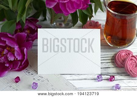 Peonies Flowers Pink Glass Of Tea With Greeting Card Marshmallow On A White Wooden Background - Stoc