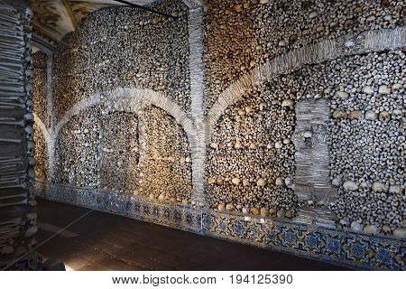 Evora, Portugal - June 12, 2017: Chapel of the Bones (Capela dos Ossos) with human bones and skulls in the wall is one of the best known monuments in Evora Alentejo Portugal