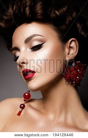Beauty woman with blue eyes and red lips. Shine skin. Cosmetics.