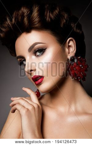 Beauty woman with blue eyes and red lips. Shine skin. Cosmetics.
