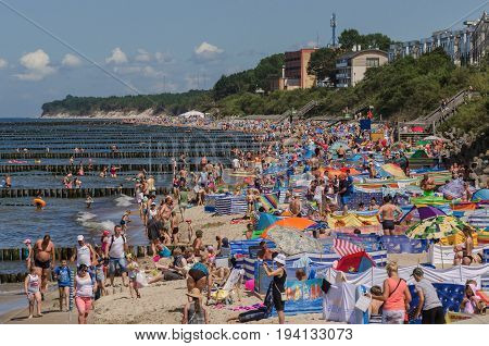 USTRONIE MORSKIE, WEST POMERANIAN / POLAND - 2017: Holiday day on the Baltic Sea beach
