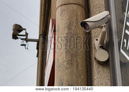 Video camera security system cctv on the wall of the building close-up