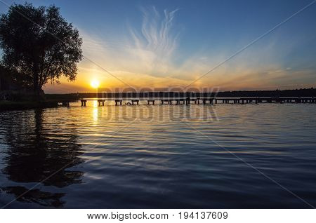 Sunset over bridge ,Necko lake,  Masuria, Poland.