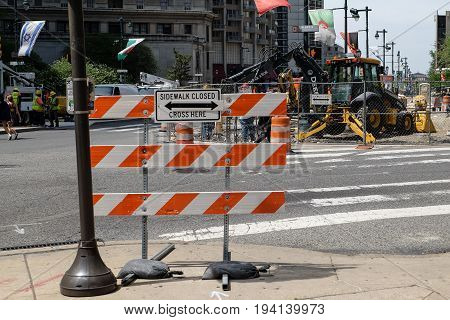 PHILADELPHIA, UNITED STATES - April 25, 2016: Road under construction and sign of sidewalk closed in Philadelphia, Pennsylvania, USA