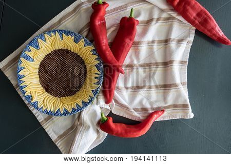 Peppers with Sunflower Bowl on stripped towel