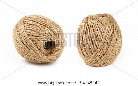 Two Coil Bobbins Of Burlap Jute Twine Over White