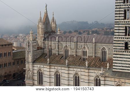 Italy Siena - December 26 2016: the view from facciatone of Duomo di Siena or Metropolitan Cathedral of Santa Maria Assunta on December 26 2016 in Siena Tuscany Italy.
