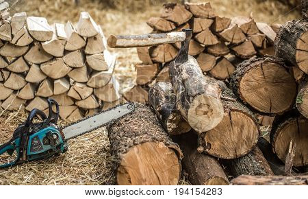Man Chopping Wood With A Chainsaw