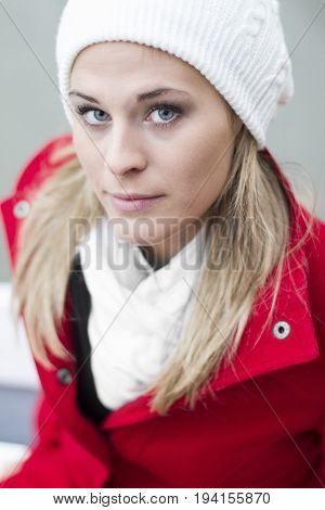Portrait of a young woman with a red coat