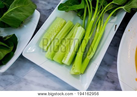 Close up Green vegetables on a white plate.