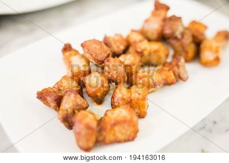 Crispy pork belly on  white plate, Thai food.