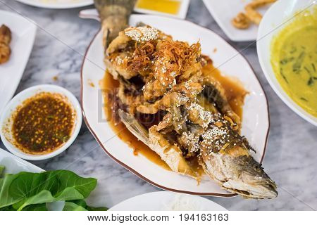 Deep Fried Sea Bass with Sauce on white dish,Thai food.