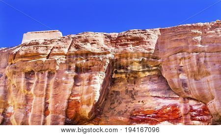 Red Rock Formation Abstracts Near Royal Tombs Petra Jordan Built by the Nabataens in 200 BC to 400 AD. Rose Red canyon walls create many abstracts close up. Reds are created by magnesium in sandstone.