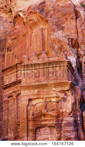 Rose Red Yellow Rock Tomb Street of Facades Petra Jordan. Built by the Nabataens in 200 BC to 400 AD. Rose Red canyon walls create many abstracts close up. Inside the Tombs the rose red can become blood red. Reds are created by magnesium in sandstone.