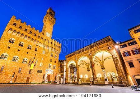 Florence Italy. Palazzo Vecchio (or Palazzo della Signoria ) and Loggia dei Lanzi twilight scene in Tuscany.
