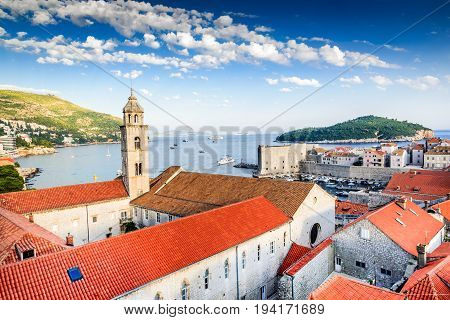 Dubrovnik Croatia. Sunset golden light over Old Town roofs of Ragusa Adriatic Sea.