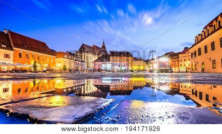 BRASOV ROMANIA - 29th JUNE 2017: Brasov Transylvania Romania - Twilight image with water reflection of Council House medieval downtown.