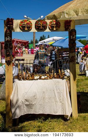 Mature Man Sells Ukrainian Souvenirs During Strawberry Festival