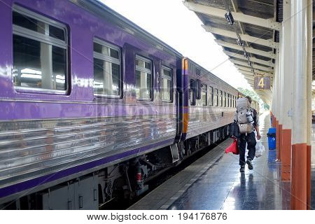 Young traveler man in railway. Travel Concept.