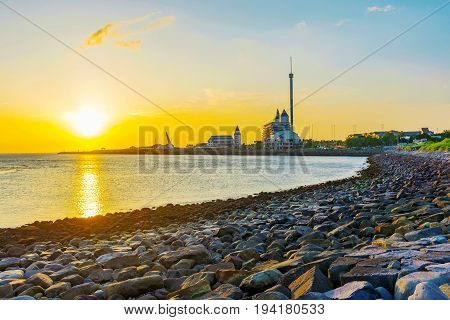View of Tamsui from a pebble beach during sunset in Taipei