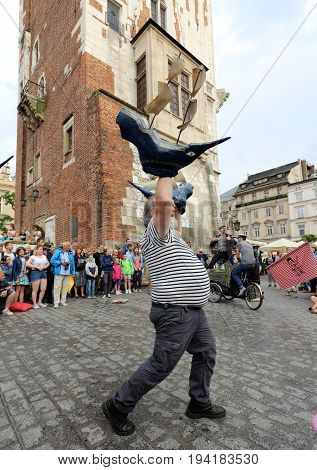 CRACOW POLAND - JULY 5 2017: 30th Street - International Festival of Street Theaters in Cracow Poland. An Odyssey Towards New Shores - a street parade