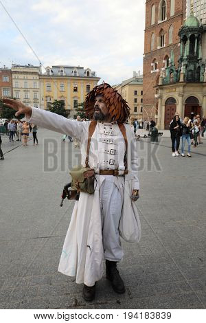 CRACOW POLAND - JULY 5 2017: 30th Street - International Festival of Street Theaters in Cracow Poland. An Odyssey Towards New Shores - a street parade