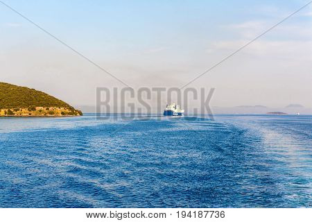 Grimaldi Group eurocargo ship cruising at sunset in Corfu, Greece