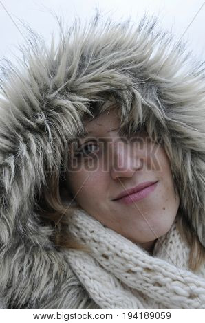 Girl with hood looking in to the lens