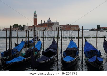 Gondolas and Chiesa di San Giorgio Maggiore, San Marco square in Venice, Italy