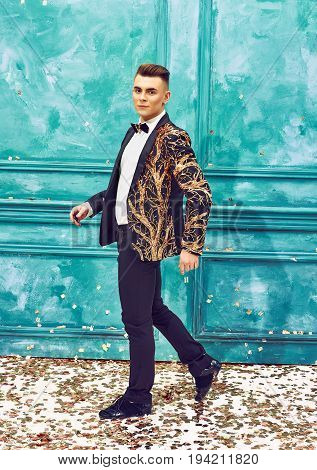 The studio shot of male dancer dancing at retro dress. Concept of cabaret, luxury party and jazz