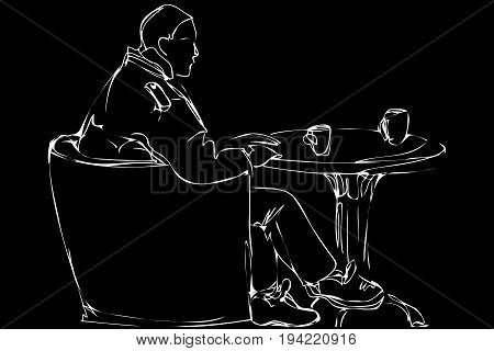 Man In A Chair Drinking Tea In A Cafe