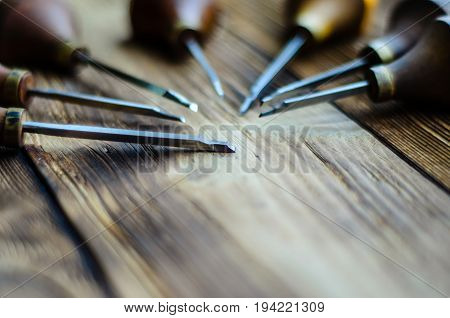 Different Gravers For Jewelry On Wooden Background