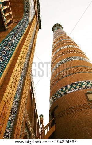 View of the Islam Khodja Minaret the fortress Ichon-Qala the old town of Khiva in Uzbekistan.