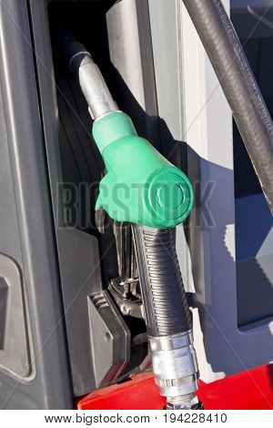 green handle petrol pump depicting an unleaded fuel or gasoline