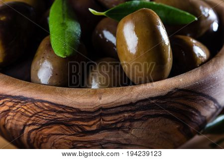 Olives And Olive Oil In Olive Wooden Bowls, Olive Tree Branch