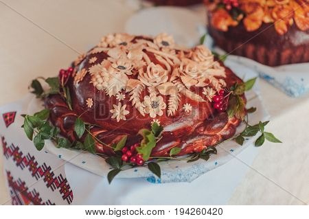 Traditional ukrainian wedding bread on an embroidery towel