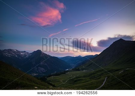 Dirt Mountain Road Leading To High Mountain Pass In Italy (colle Delle Finestre). Expasive View At S